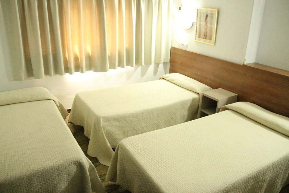 Triple Room | Desk, blackout drapes, free WiFi, bed sheets