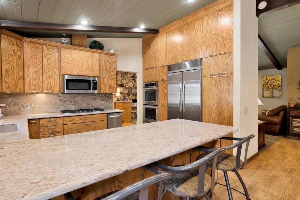 Bright dining area with seating for four, perfect for shared meals, morning coffee, and easy access to the living room