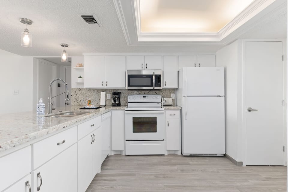 Granite countertop on fully stocked kitchen