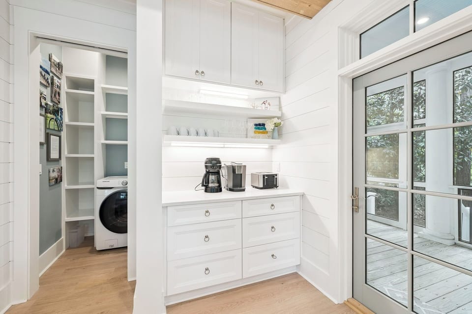 Your bright butler's pantry features coffee station and laundry access, making mornings effortless.