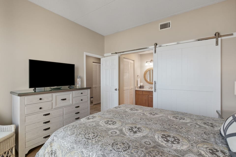 Bedroom 2 on Lower Level with Attached Full Bath and Balcony Access (King Bed)