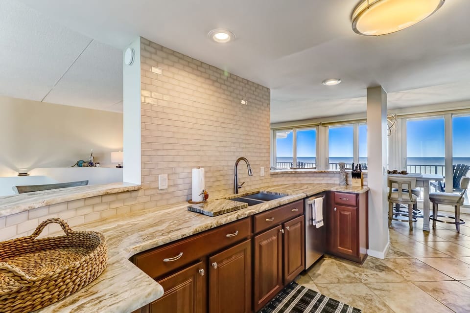 Sparkling Updated Kitchen with Quartz Countertop and Tile Backsplash