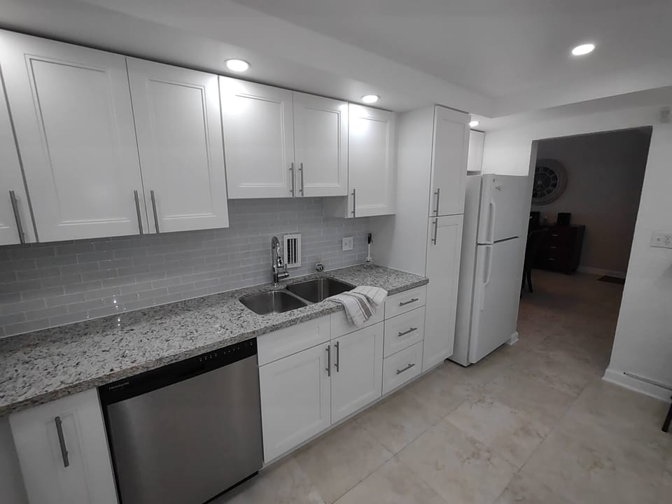 Kitchen area with full size fridge