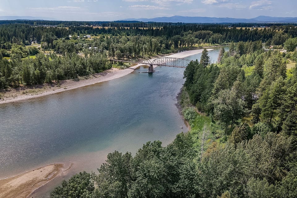 Mountains behind the beautiful river | Aerial