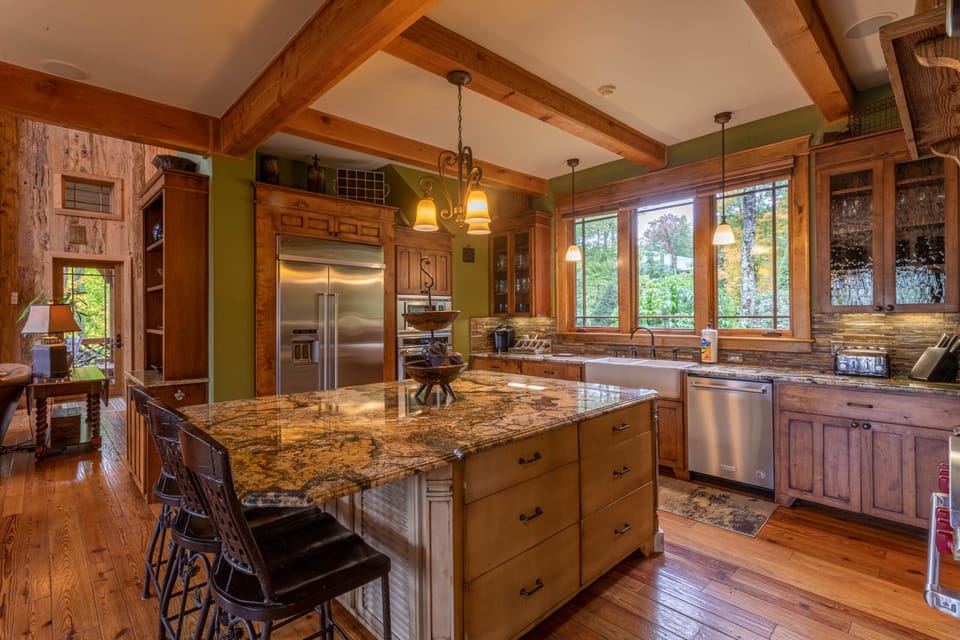 Fully stocked kitchen with gas range, double oven, dishwasher and walk in pantry.