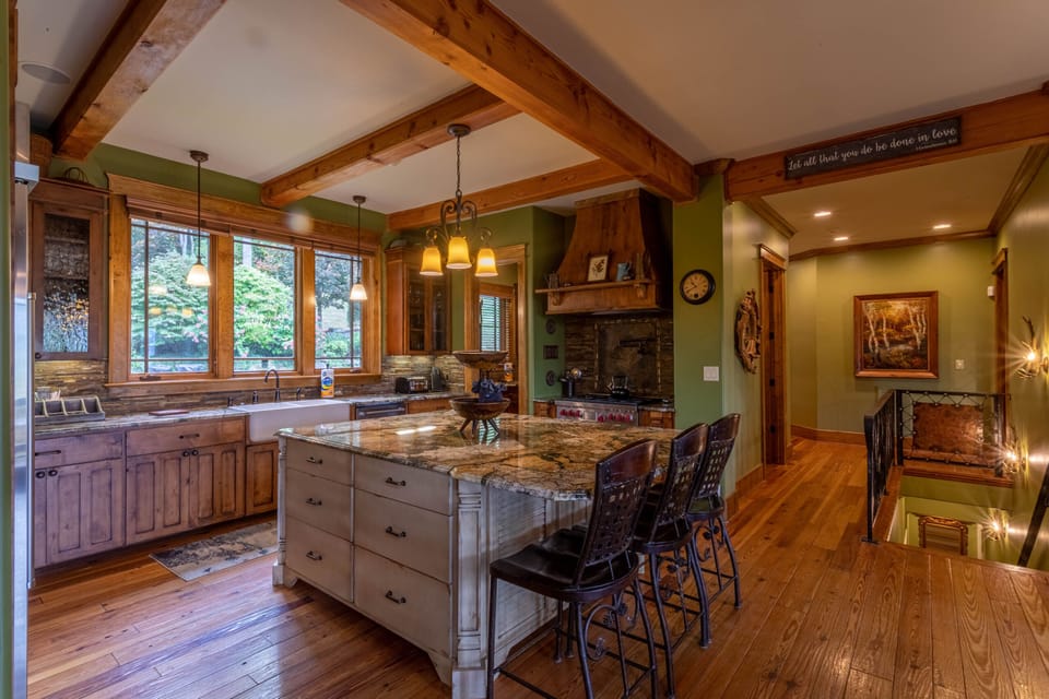 Fully stocked kitchen with gas range, double oven, dishwasher and walk in pantry.