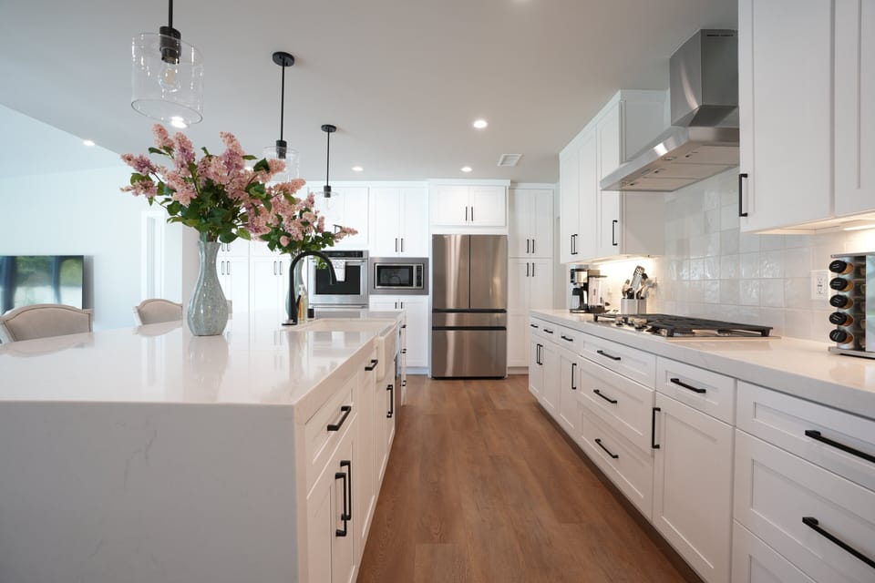 Custom Open Concept Kitchen with Stainless Steel Appliances. The Kitchen Island has seating for 4