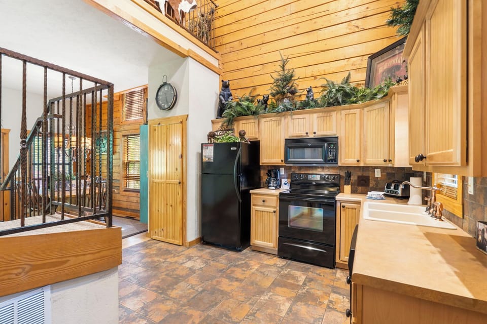 Kitchen and Steps Leading to the 2 Upper Bedrooms
