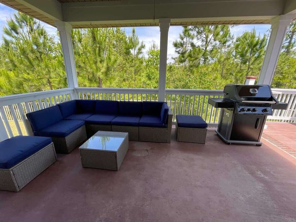 - Fire up the grill and enjoy a meal with friends on this spacious, shaded patio - Comfortable sectional seating makes it perfect for relaxing after a day at the beach - Surrounded by peaceful greenery, your private outdoor retreat awaits