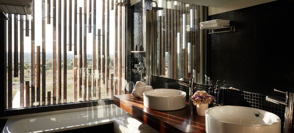 Bathtub, hair dryer, bathrobes, slippers