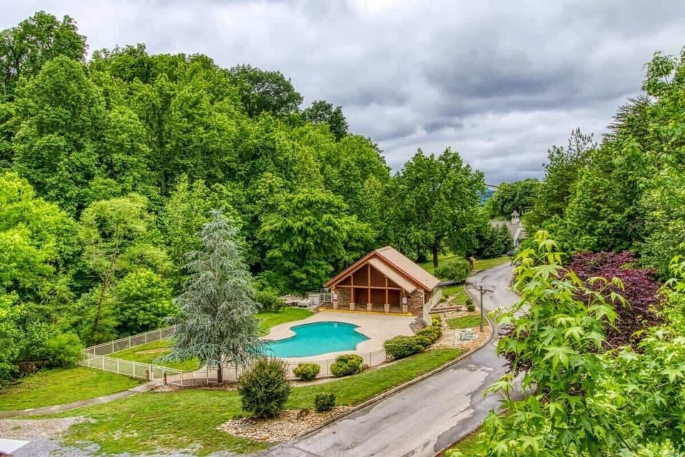 Enjoy picturesque views of the resort-style pool, just one of the many beautiful sights surrounding the cabin.