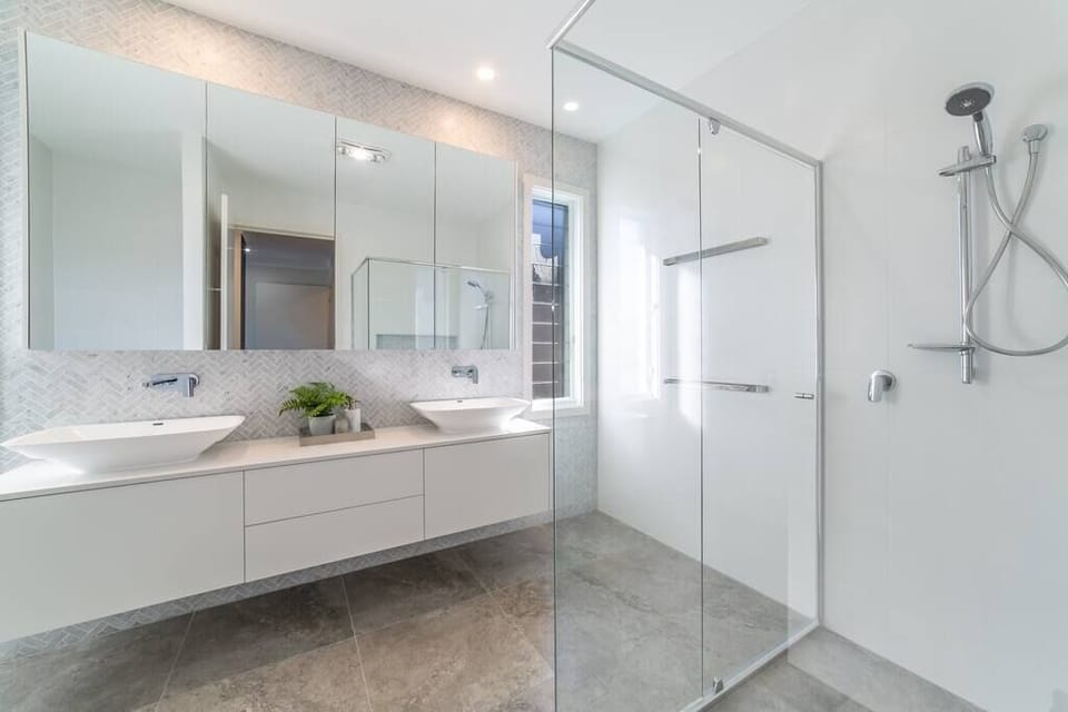 Master ensuite adds accessible-friendly bathroom features.