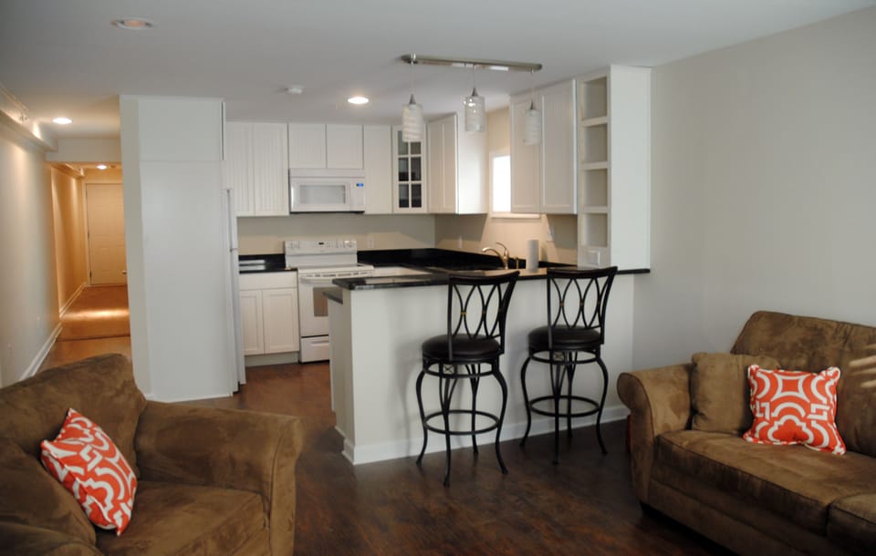 Bar seating; open floor plan with living room.