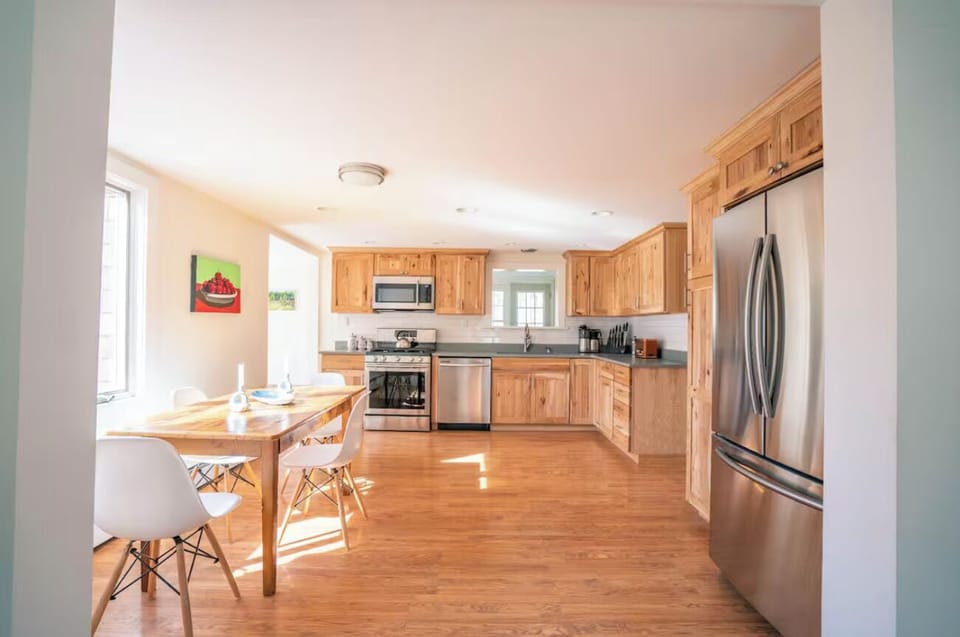 Kitchen and dining area filled with natural sunlight