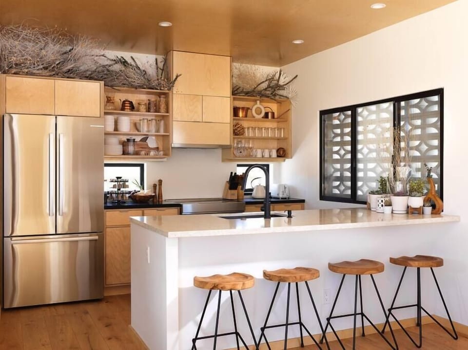The kitchen is is fitted with new stainless steel appliances and everything you need to prepare a meal.