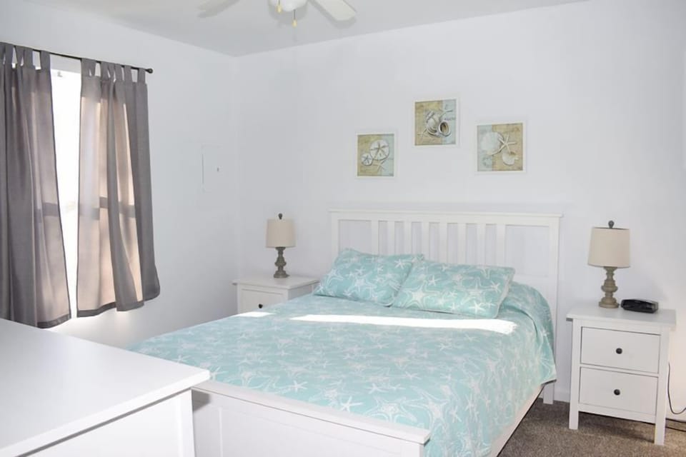 Larger Bedroom with a queen bed
