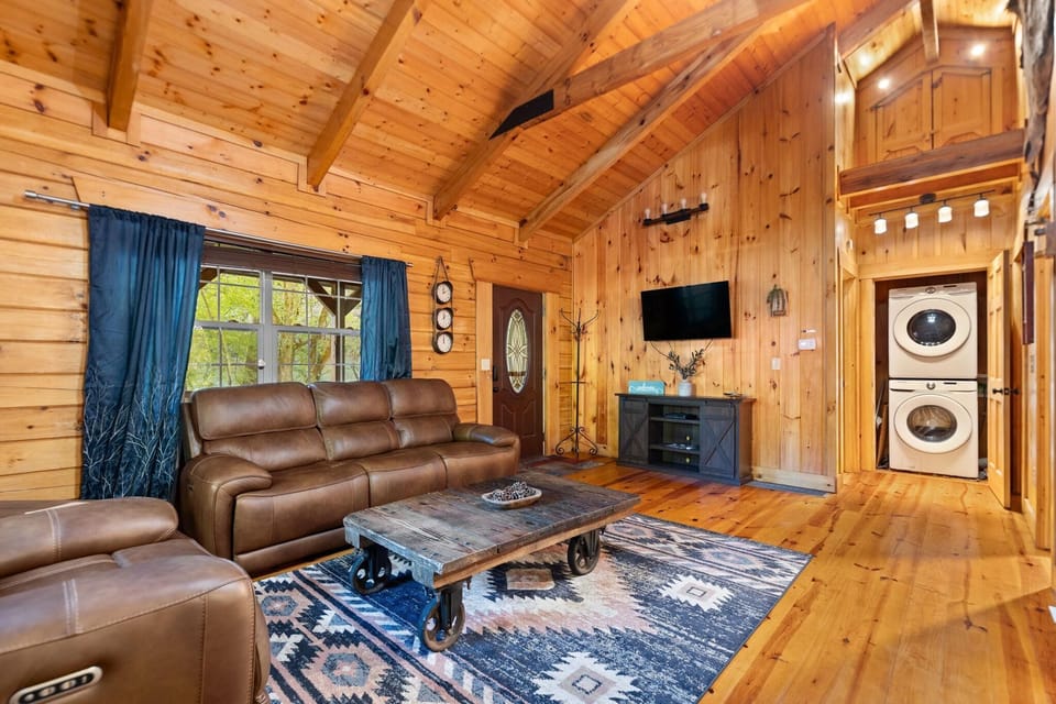 Cozy living room with vaulted ceilings and rustic charm
