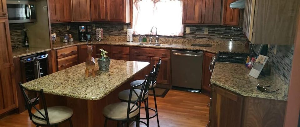 Updated kitchen with center aisle and seating