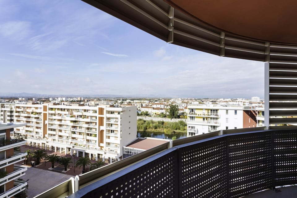 Step out onto the private balcony and enjoy views of the surrounding area. Views vary.