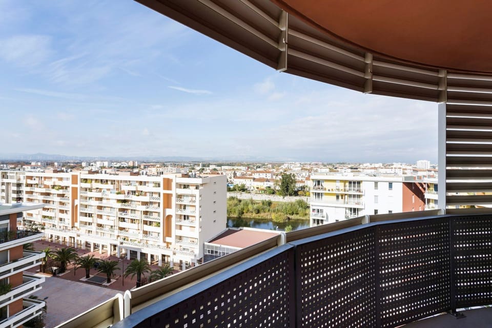 Balcony offers a panoramic view of the surrounding area and distant mountains