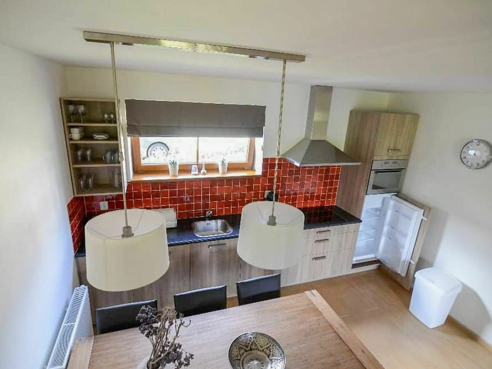 Furniture, Cabinetry, Table, Kitchen, Couch, Television, Wood, Chair, Interior Design, Shelving