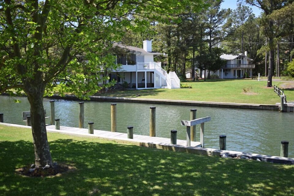 Private boat dock and pier, located on the canalside of property.