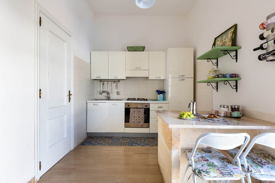 Villa | Private kitchen | Full-size fridge, oven