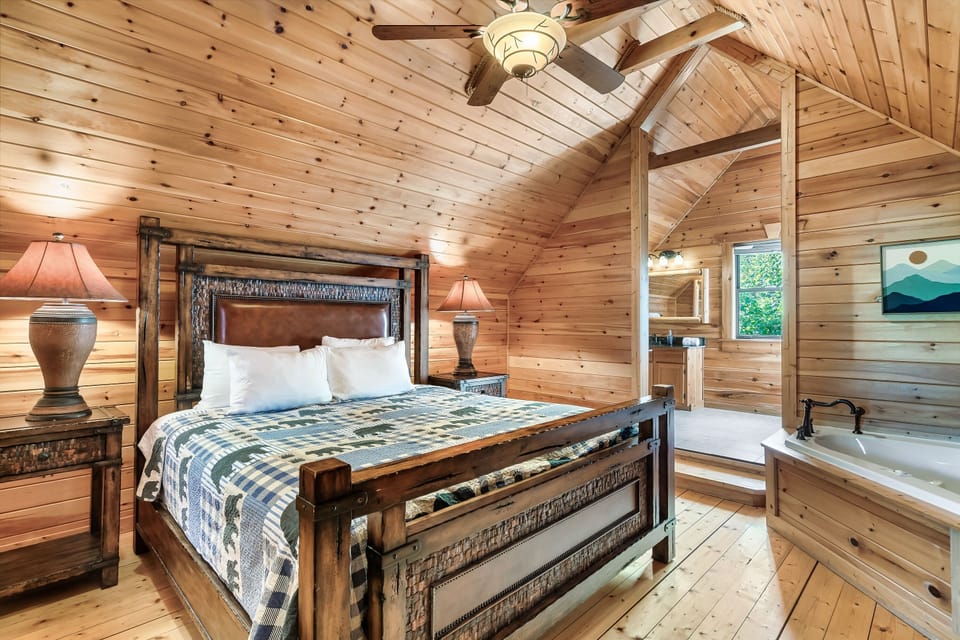 Primary bedroom features a King size bed, Roku TV, jetted tub and attached bath.