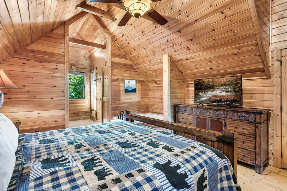 Bedroom upstairs with King sized bed and attached bathroom, and jetted tub.