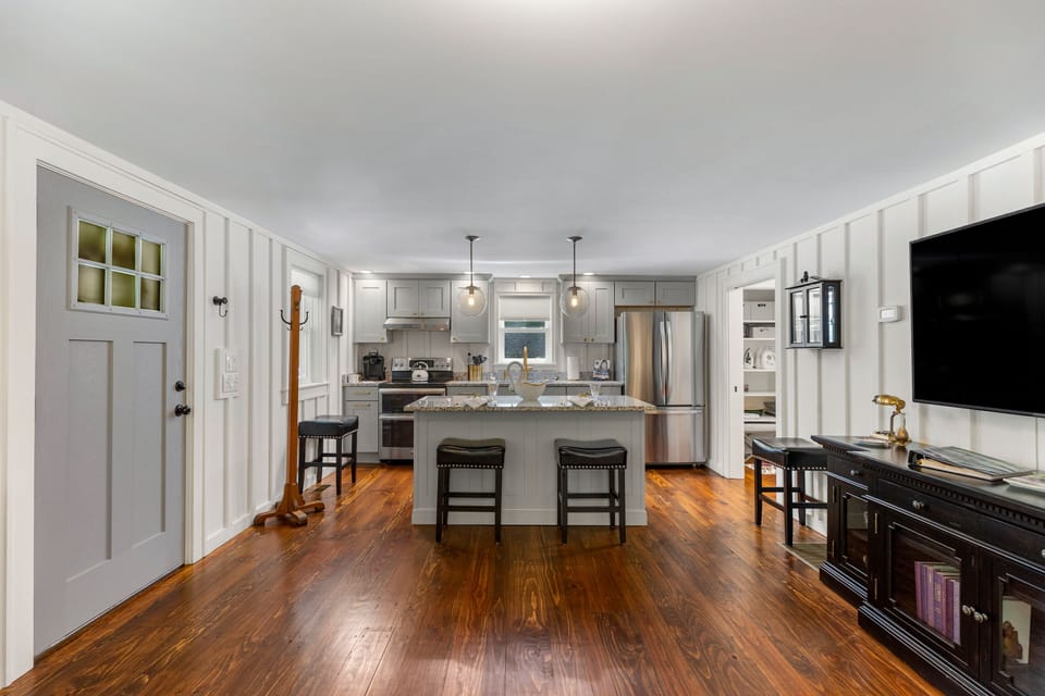 Gorgeous wood floors in the cabin except slate tiles in bathroom!