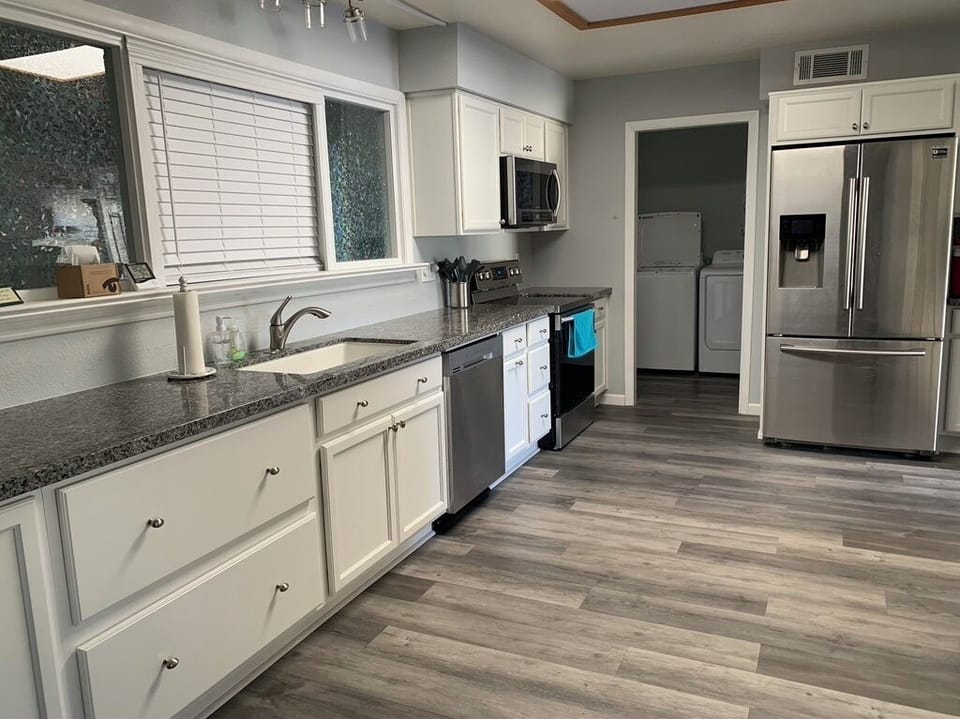 Kitchen with view of laundry room