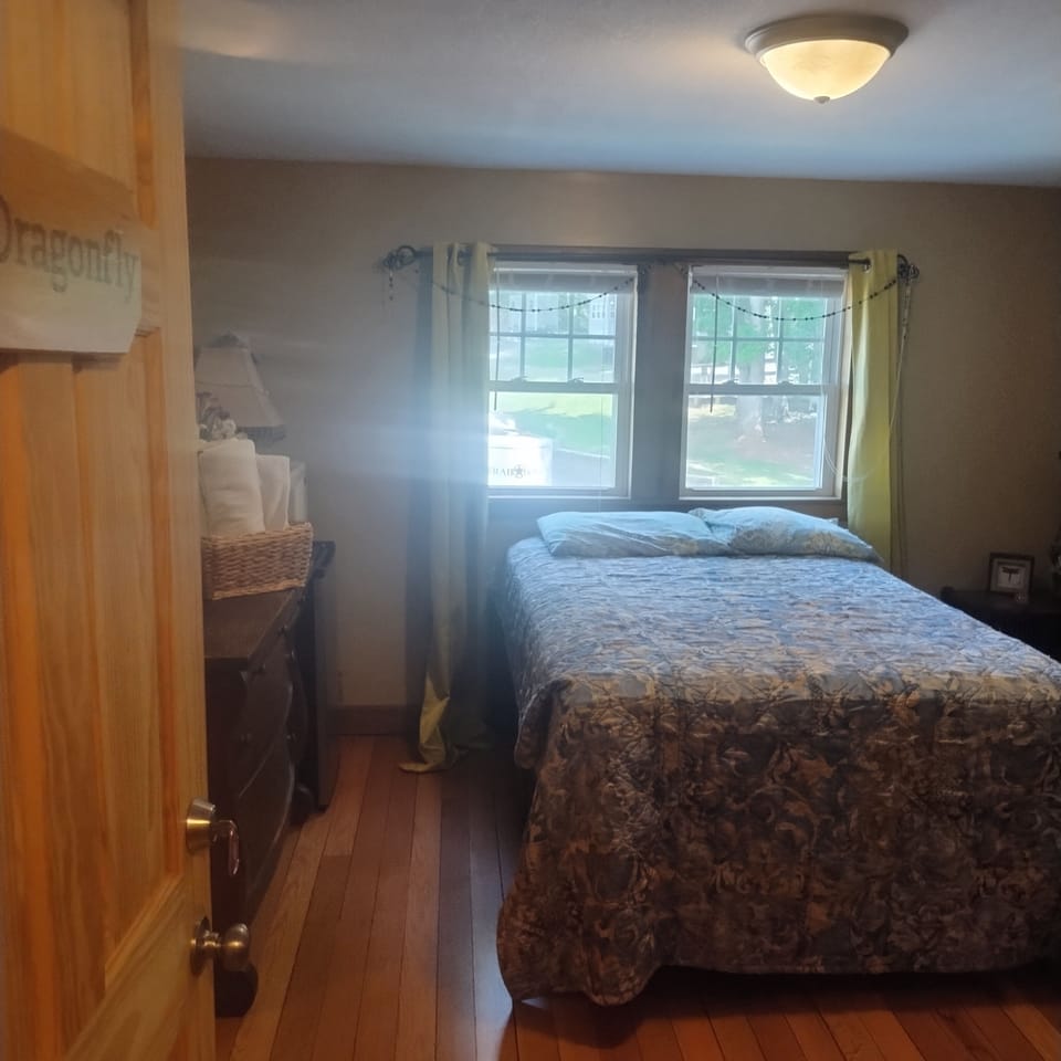 guestroom upstairs in main home, double bed, dresser, mini fridge, microwave