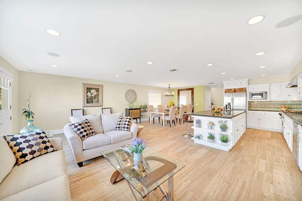 Families can comfortably spread out throughout all three levels of this vacation home that's just one house from the beach!
                