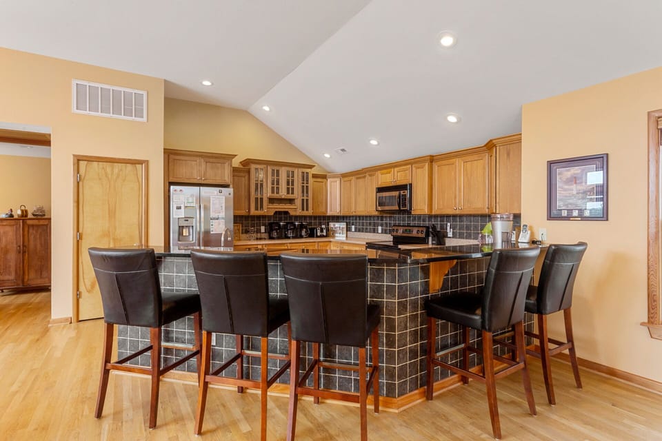 The kitchen will be an inspiration for any family chef thanks to stainless steel appliances and a posh adjacent breakfast bar.