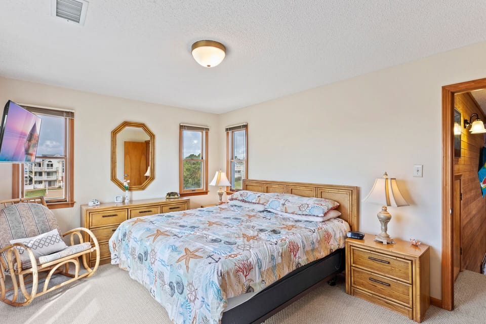 Another Master Bedroom with a Flat Screen TV and Deck Access offers quiet comfort and a peaceful retreat.