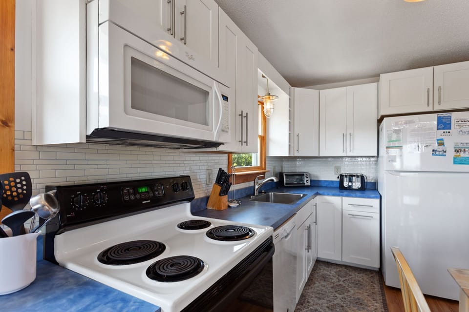 Fully equipped kitchen with seating for 8 at the dining table—ideal for family meals and gatherings.