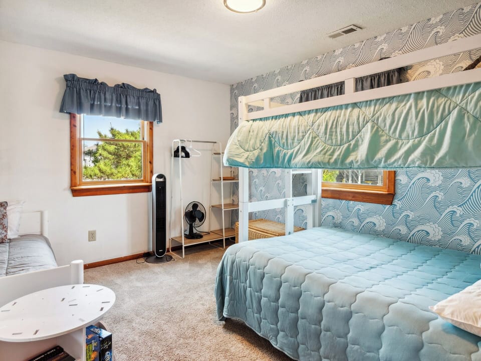 Fun bedroom for the kids with a Bunk Set, Twin Platform Bed, and Trundle—plenty of space for everyone to sleep soundly.