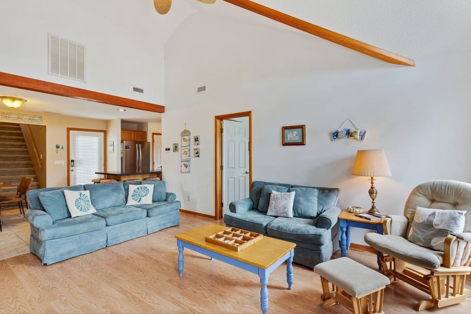 Living Area: Bright, inviting living space with updated furniture and abundant natural light.