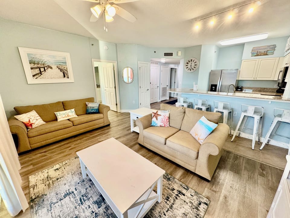 Relax in the spacious open living area with queen sleeper sofa