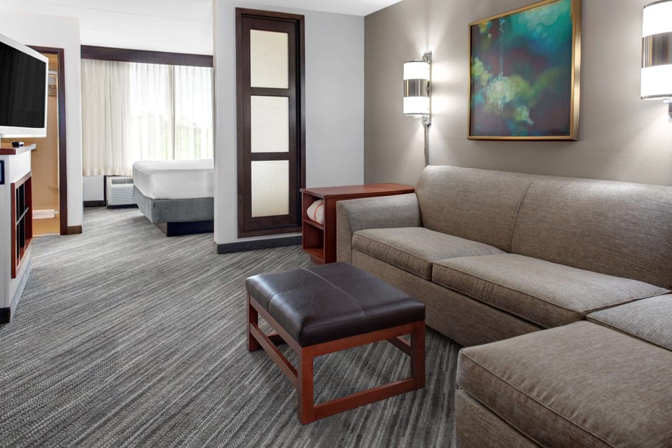 Premium bedding, desk, laptop workspace, blackout drapes