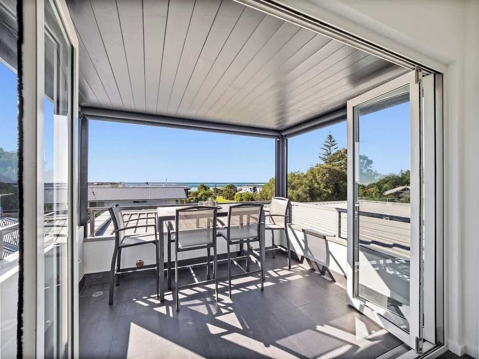 Unwind with evening breezes on the intimate upper balcony, the perfect couple’s retreat.