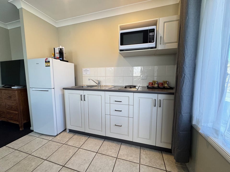 2 Bedroom Apartment | Private kitchen | Coffee/tea maker, mini-fridge, microwave, electric kettle