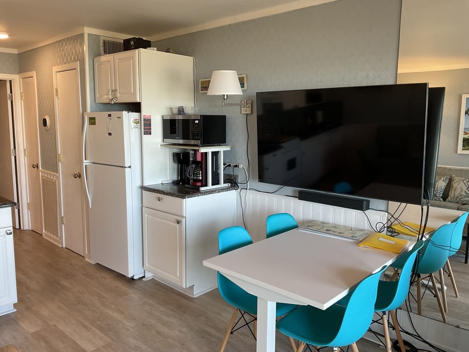 Fridge with ice-maker, microwave, coffee/breakfast station.