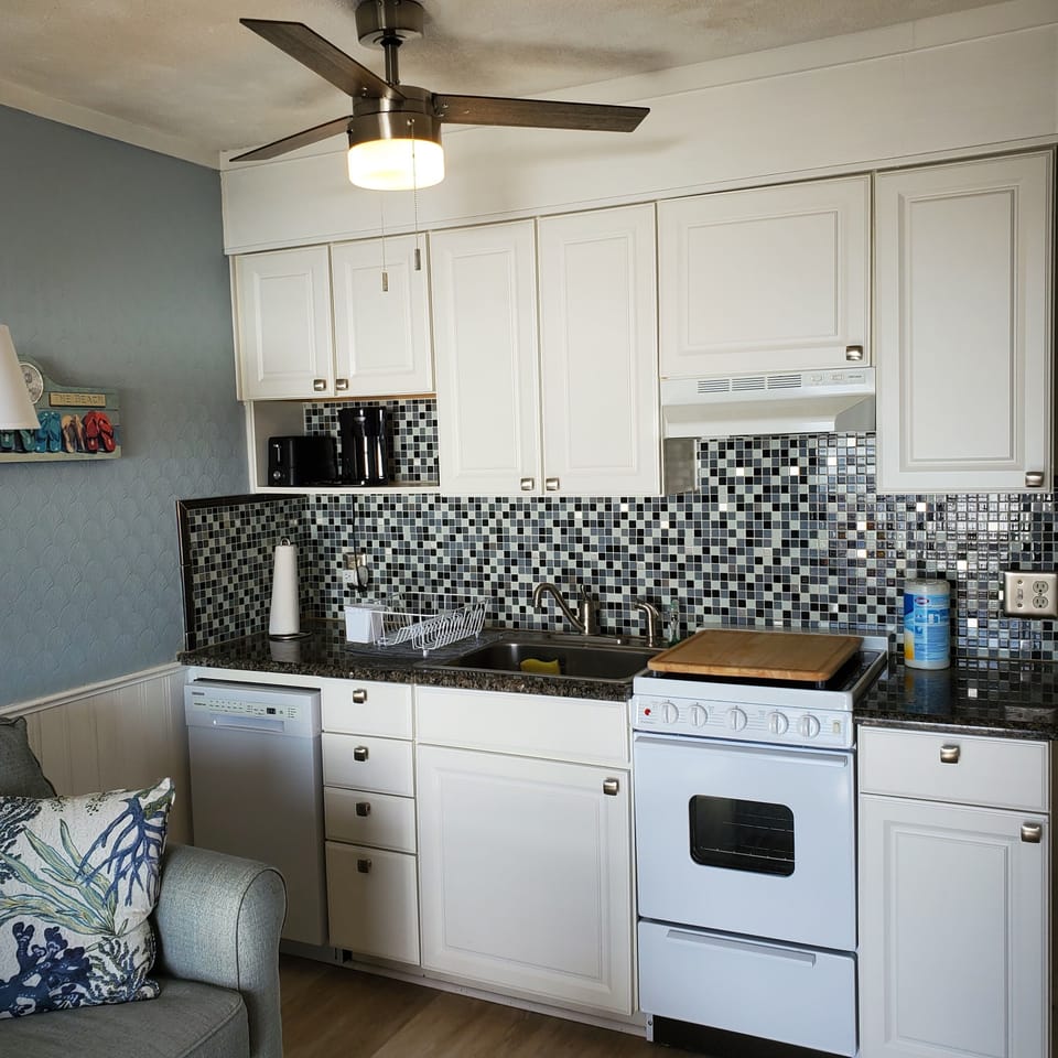 New smooth ceiling with fan and lights. New smooth top range with countertop.