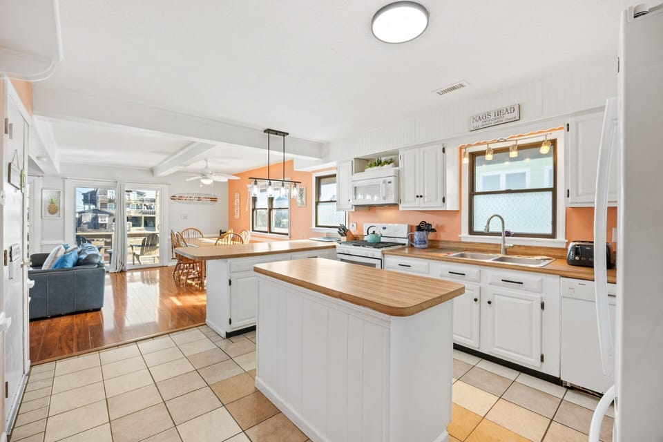 A fully stocked kitchen features ample prep space for home-cooked meals.