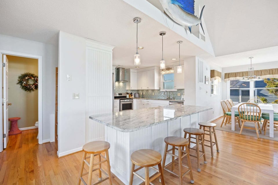 The fully equipped kitchen features modern appliances and ample counter space for preparing family meals.