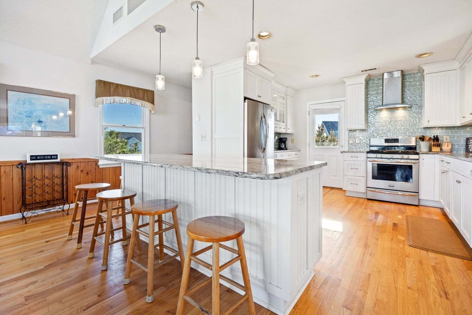 The fully equipped kitchen features modern appliances and ample counter space for preparing family meals.