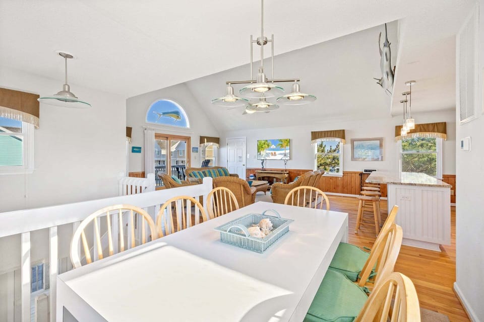 The dining area offers seating for six and is conveniently located just off the kitchen.