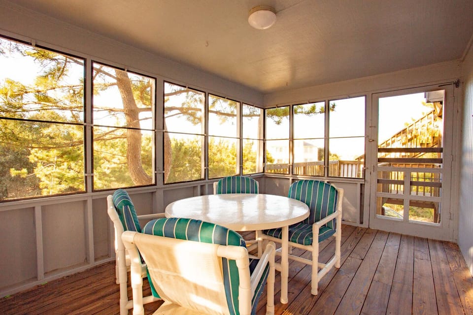 Step outside for some al fresco dining in the Screened-In Porch.