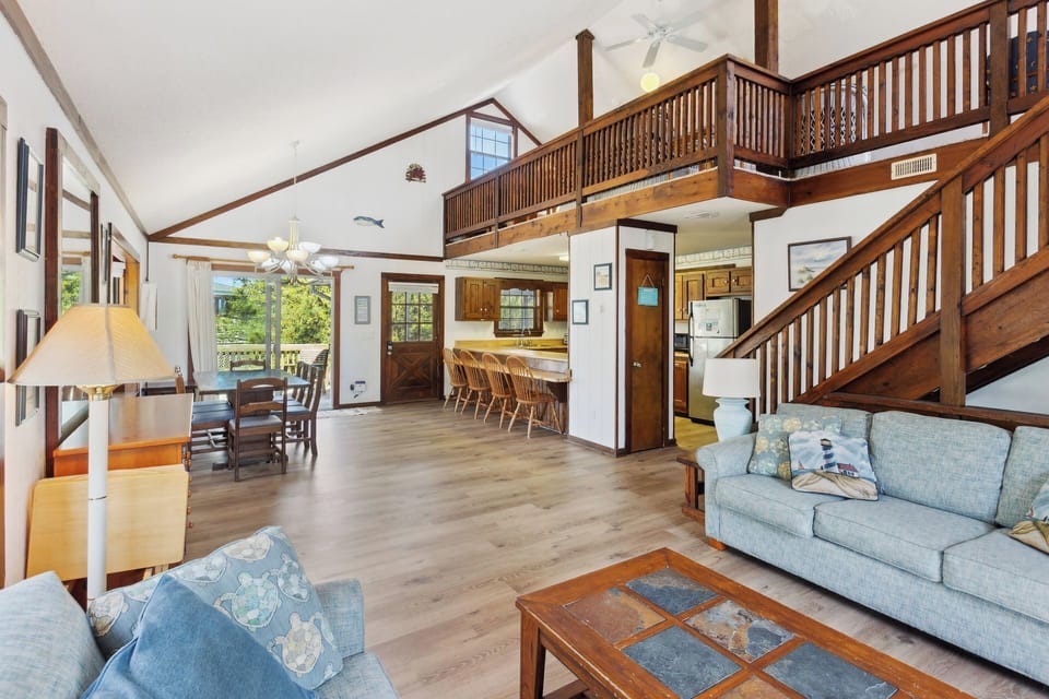 Relax in the spacious Living Area with a large, Flat Screen TV and lots of cozy furniture.